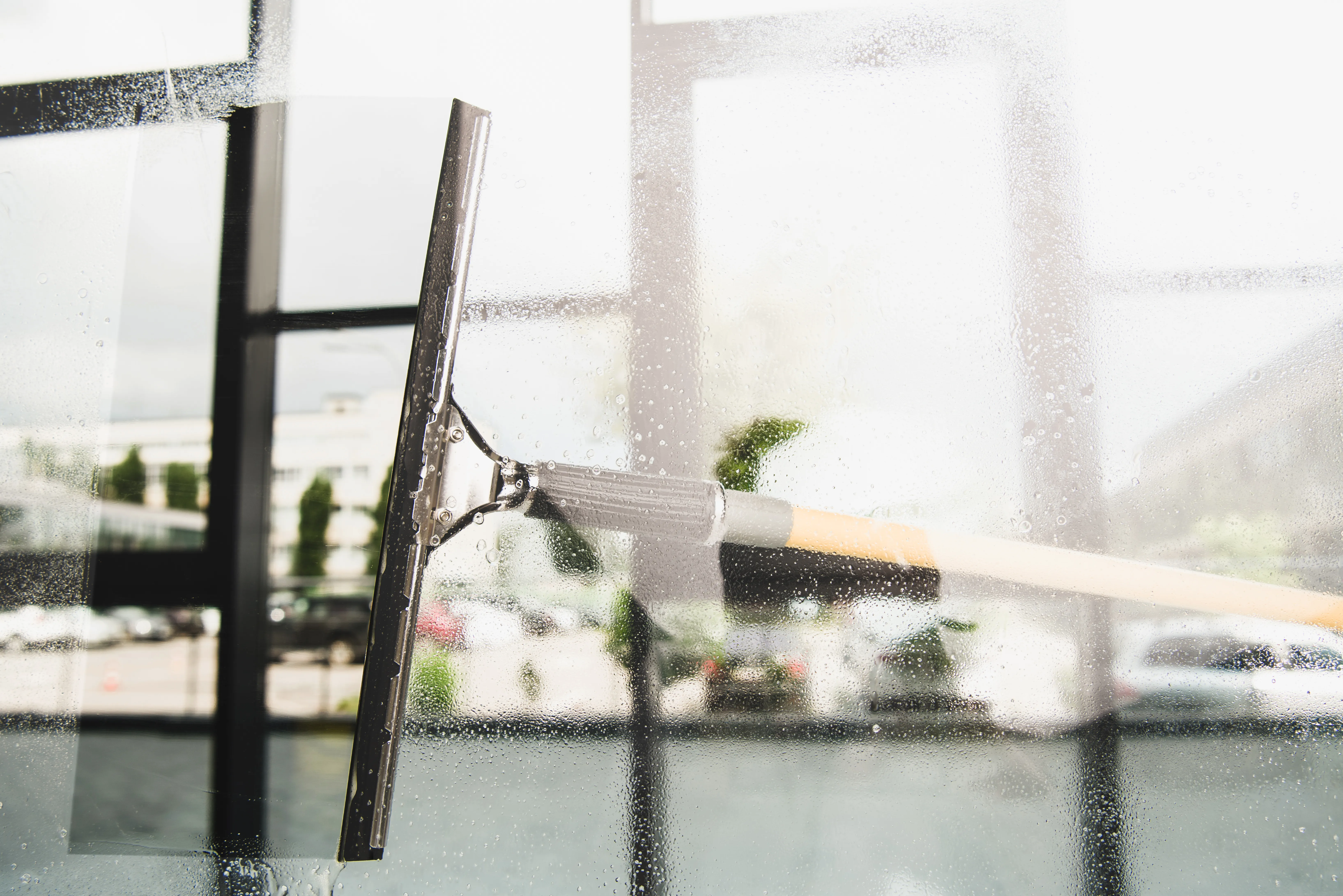Window wiping close-up — Ange Cleaning Minnesota